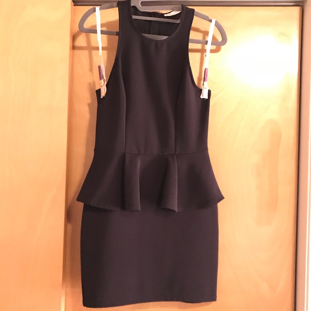 Black racer back peplum dress